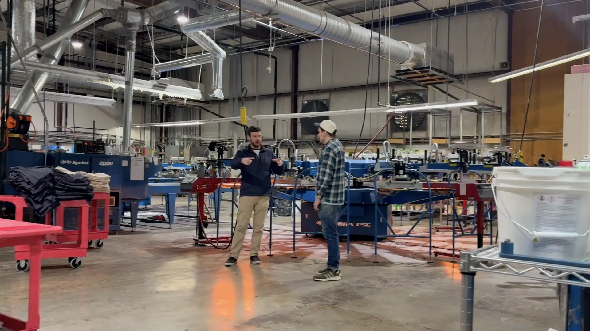 Team members talking on the print floor